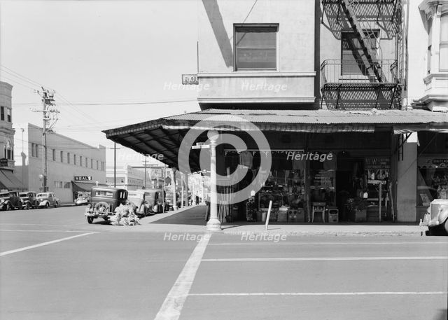 Secondhand store, street corner of San Joaquin Valley town on U.S. 99, Fresno, CA, 1939. Creator: Dorothea Lange.
