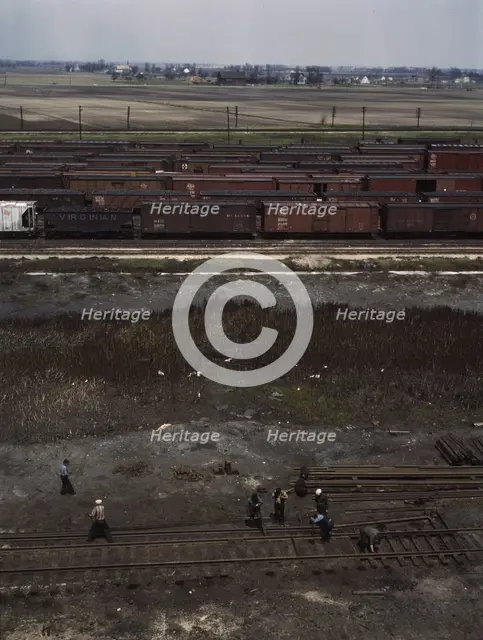 Section crew at work on the track, C. M. St. P. & P. R.R., Bensenville, Ill., 1943. Creator: Jack Delano.