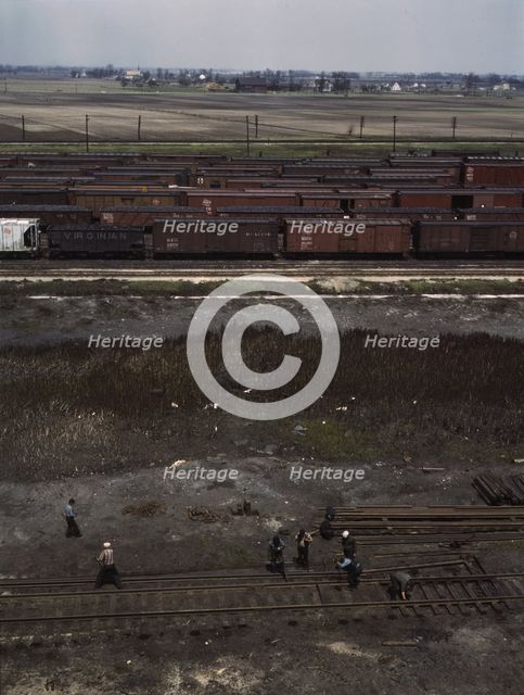 Section crew at work on the track, C. M. St. P. & P. R.R., Bensenville, Ill., 1943. Creator: Jack Delano.