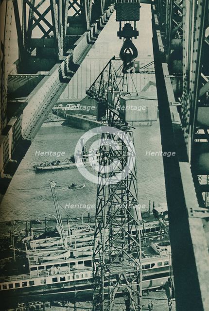 'Seen from a crane, the River Clyde has appearance of a long narrow dock basin', 1937. Artist: Unknown.
