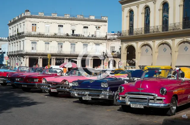 Selection of beautifully restored old American cars, alongside the Parque Central, Havana, Cuba,2024 Creator: Ethel Davies.