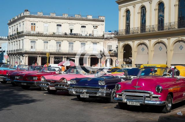Selection of beautifully restored old American cars, alongside the Parque Central, Havana, Cuba,2024 Creator: Ethel Davies.