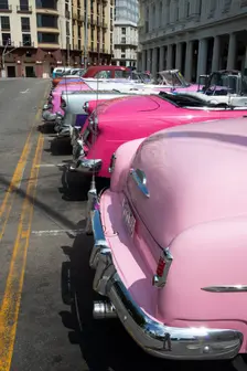 Selection of beautifully restored old American cars alongside the Parque Central, Havana, Cuba, 2024 Creator: Ethel Davies