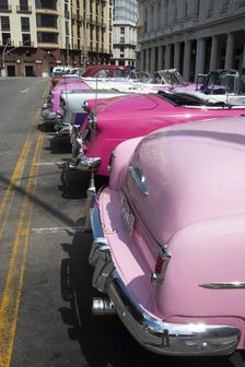 Selection of beautifully restored old American cars alongside the Parque Central, Havana, Cuba, 2024 Creator: Ethel Davies