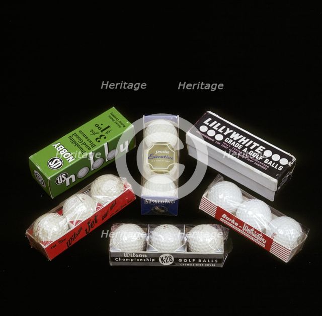 Selection of golf balls in their packaging, mid 20th century. Creators: Wilson Sporting Goods, Spalding, US Rubber Company, Victor Comptometer Corporation.