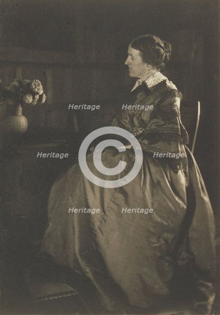 Self-portrait with Table and Flowers, 1896-1899. Creator: Gertrude Kasebier.