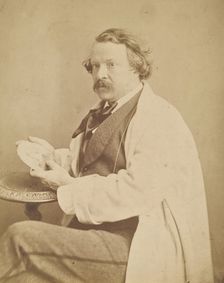 Self-portrait holding medallion commemorating his deceased mother, 1860-1861. Creator: Nadar