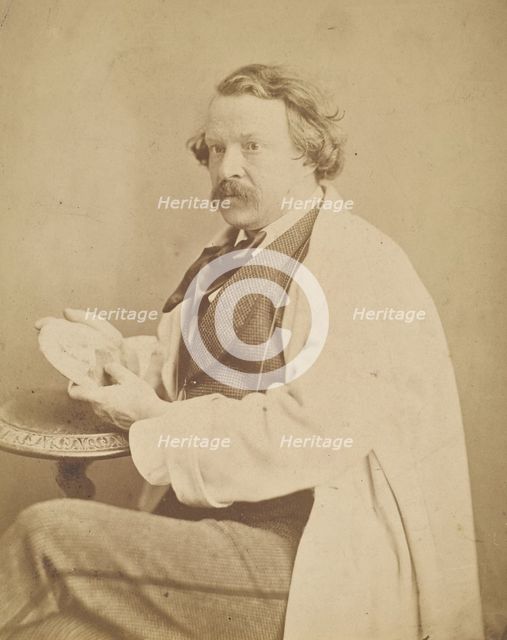 Self-portrait holding medallion commemorating his deceased mother, 1860-1861. Creator: Nadar.