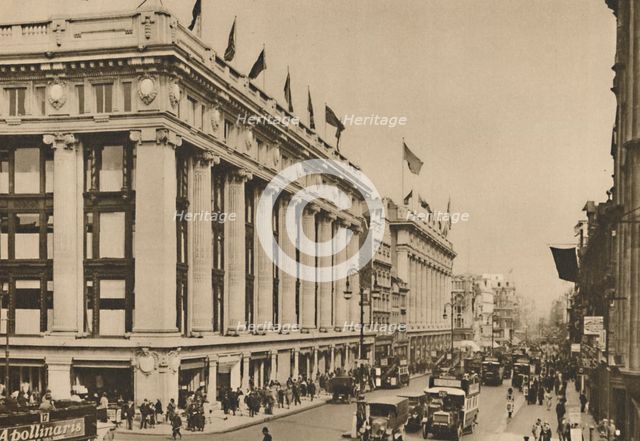 'Selfridge's and the last of the old Oxford Street shops that the building engulfed', c1935. Creator: Unknown.