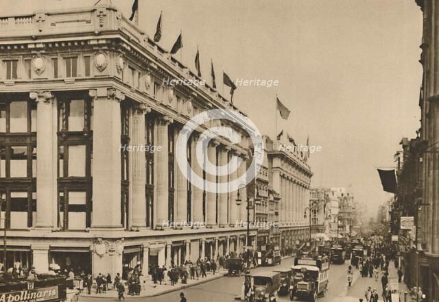 'Selfridge's and the last of the old Oxford Street shops that the building engulfed', c1935. Creator: Unknown.