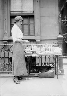 Selling medals etc. before St. Anne's, between c1910 and c1915. Creator: Bain News Service
