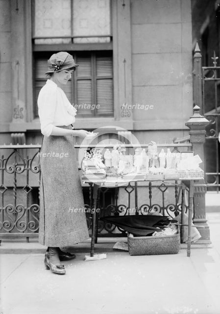 Selling medals etc. before St. Anne's, between c1910 and c1915. Creator: Bain News Service.