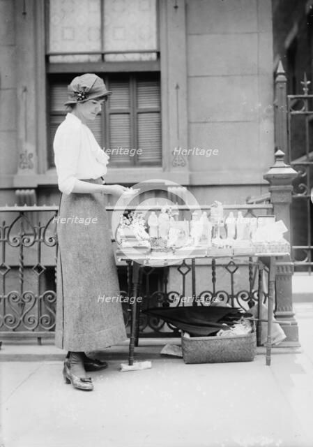Selling medals etc. before St. Anne's, between c1910 and c1915. Creator: Bain News Service.