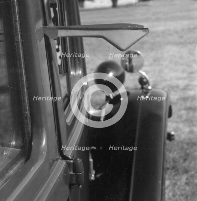 Semaphore indicator arm on 1937 Morris 8 series II. Creator: Unknown.