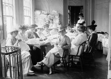 Senate Women Sewing, at District Headquarters, Red Cross, 1917. Creator: Harris & Ewing