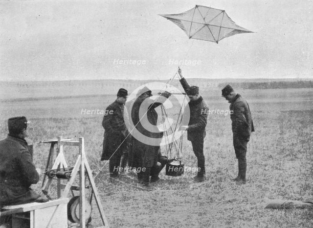 'Sending up one of the French war kites, to which a camera is attached', 1914, (1915). Artist: Unknown.