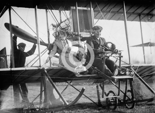 Senorita Lenore Riviero [sic] with Anthony Jannus; In Rex Smith Aeroplane, 1912. Creator: Harris & Ewing.