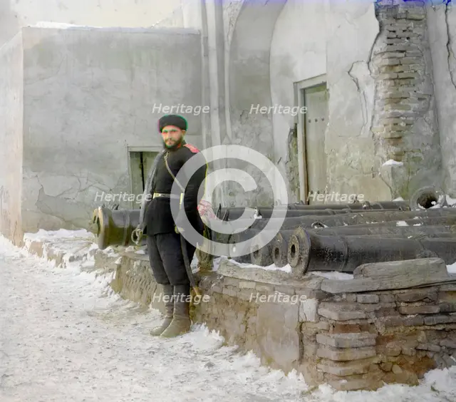 Sentry at the palace, and old cannons, Bukhara, between 1905 and 1915. Creator: Sergey Mikhaylovich Prokudin-Gorsky.