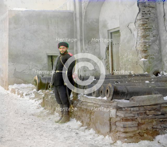 Sentry at the palace, and old cannons, Bukhara, between 1905 and 1915. Creator: Sergey Mikhaylovich Prokudin-Gorsky.