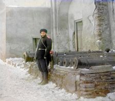 Sentry at the palace, and old cannons, Bukhara, between 1905 and 1915. Creator: Sergey Mikhaylovich Prokudin-Gorsky