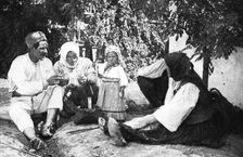 Serbian family telling the story of routing the Austrians from Bosnia, First World War, 1914