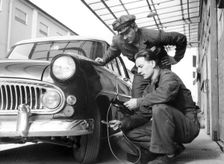 Service at a garage, Trelleborg, Sweden, 1950s. Creator: Unknown
