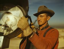 Servicing one of the floodlights that turn night into day..., Columbia Steel Co., Geneva, Utah, 1942 Creator: Andreas Feininger