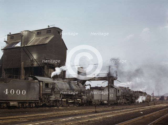 Servicing engines at coal and sand chutes at Argentine yard, Santa Fe R.R., Kansas City, 1943. Creator: Jack Delano.