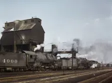 Servicing engines at coal and sand chutes at Argentine yard, Santa Fe R.R., Kansas City, 1943. Creator: Jack Delano