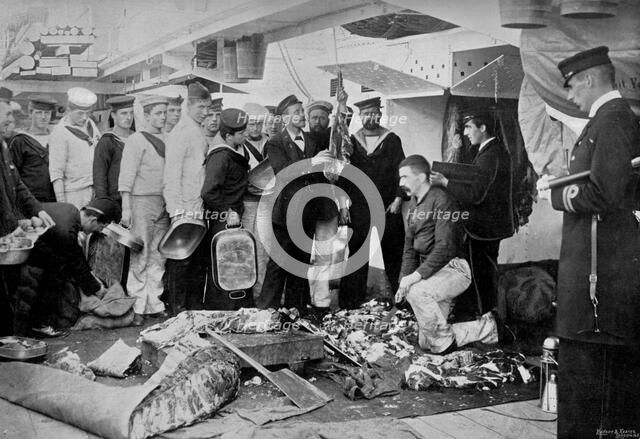 Serving out a day's fresh meat ration on board HMS 'Talbot', 1896. Artist: WM Crockett