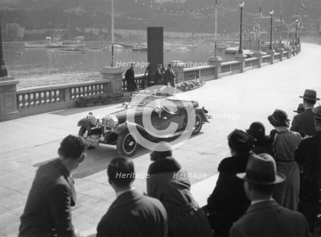 SH Light driving an SS1, at the Monte Carlo Rally, 1934. Artist: Unknown
