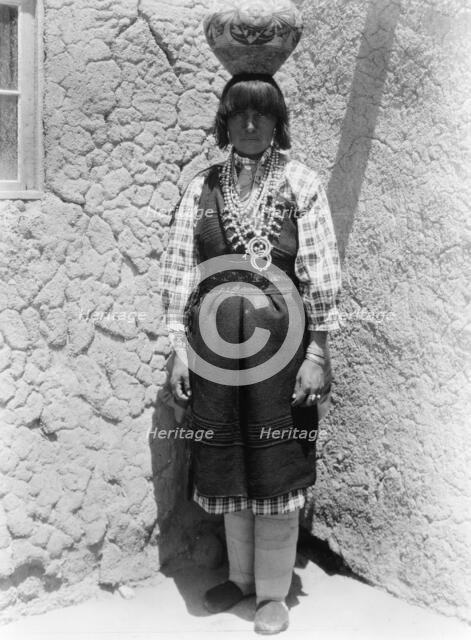 Shuati-Sia. Full-length portrait of a woman standing, facing front, with pot on head, c1926. Creator: Edward Sheriff Curtis.