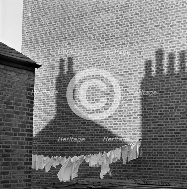 Shadows and laundry, London, 1964. Artist: John Gay