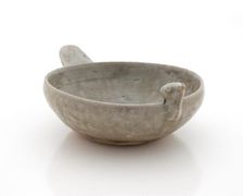 Shallow dish with bird head and tail, 265-316. Creator: Unknown