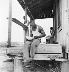Sharecropper eating near Clarksdale, Mississippi, 1937. Creator: Dorothea Lange
