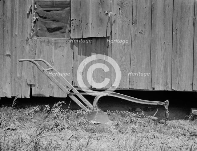 Sharecropper's cabin and sharecropper's tool, Mississippi, 1937. Creator: Dorothea Lange.