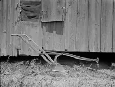 Sharecropper's cabin and sharecropper's tool, Mississippi, 1937. Creator: Dorothea Lange