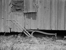 Sharecropper's cabin and sharecropper's tool, Mississippi, 1937. Creator: Dorothea Lange