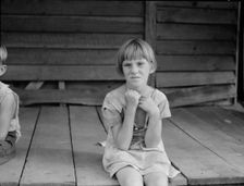 Sharecropper's child whose father receives five dollars a month, Macon County, Georgia, 1937. Creator: Dorothea Lange
