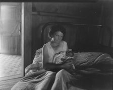 Sharecropper's wife and her youngest child, near Cleveland, Mississippi, 1937. Creator: Dorothea Lange