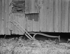Sharecropper's cabin and sharecropper's tool, Mississippi, 1937. Creator: Dorothea Lange