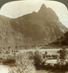 Sharp pinnacles of Romdalshorn crowning mountain wall above Rauma river, Norway c1905. Creator: Unknown