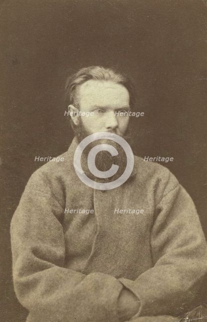 Shchedrin, one of four men chained to wheelbarrows at Kara, between 1880 and 1886. Creator: Unknown.