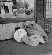 She awaits the international streetcar at a corner in El Paso, Texas to return across..., 1938. Creator: Dorothea Lange