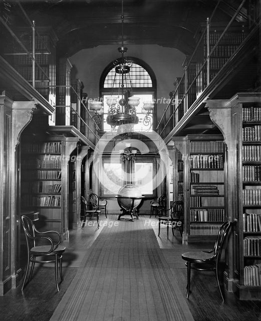 Shelves in library, U.S. Naval Academy, between 1890 and 1901. Creator: Unknown.