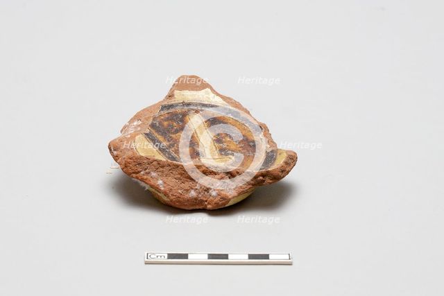 sherd, red body, white slip, yellow glaze with brown stain, Mamluk period, 1250-1516. Creator: Unknown.