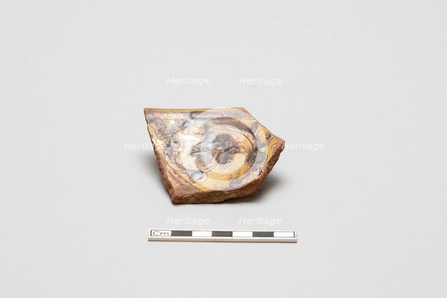sherd, red body, white slip, yellow glaze with brown stain, Mamluk period, 1250-1516. Creator: Unknown.