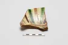 sherd, red body, white slip; green, brown, yellow striped glaze, Mamluk period, 1250-1516. Creator: Unknown