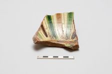 sherd, red body, white slip; green, brown, yellow striped glaze, Mamluk period, 1250-1516. Creator: Unknown