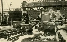 Ship supplying coal in freezing conditions, First World War, 1914, (c1920). Creator: Unknown